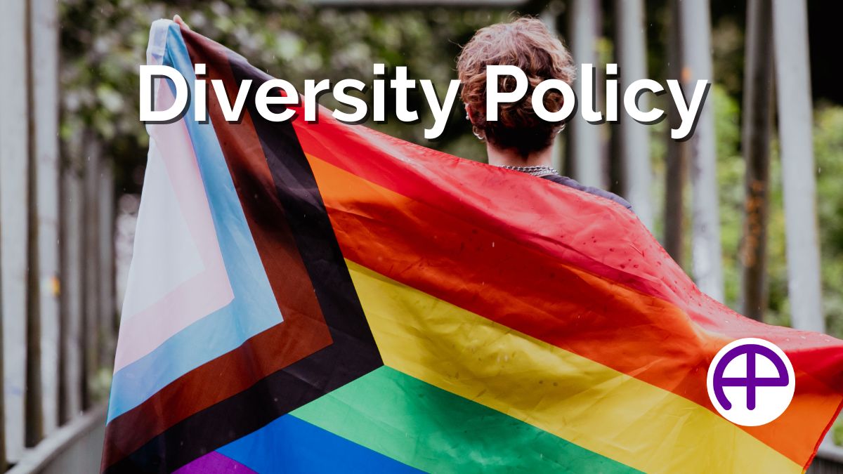 Diversity Policy Image: Person With Pride Flag Person holding pride flag representing diversity