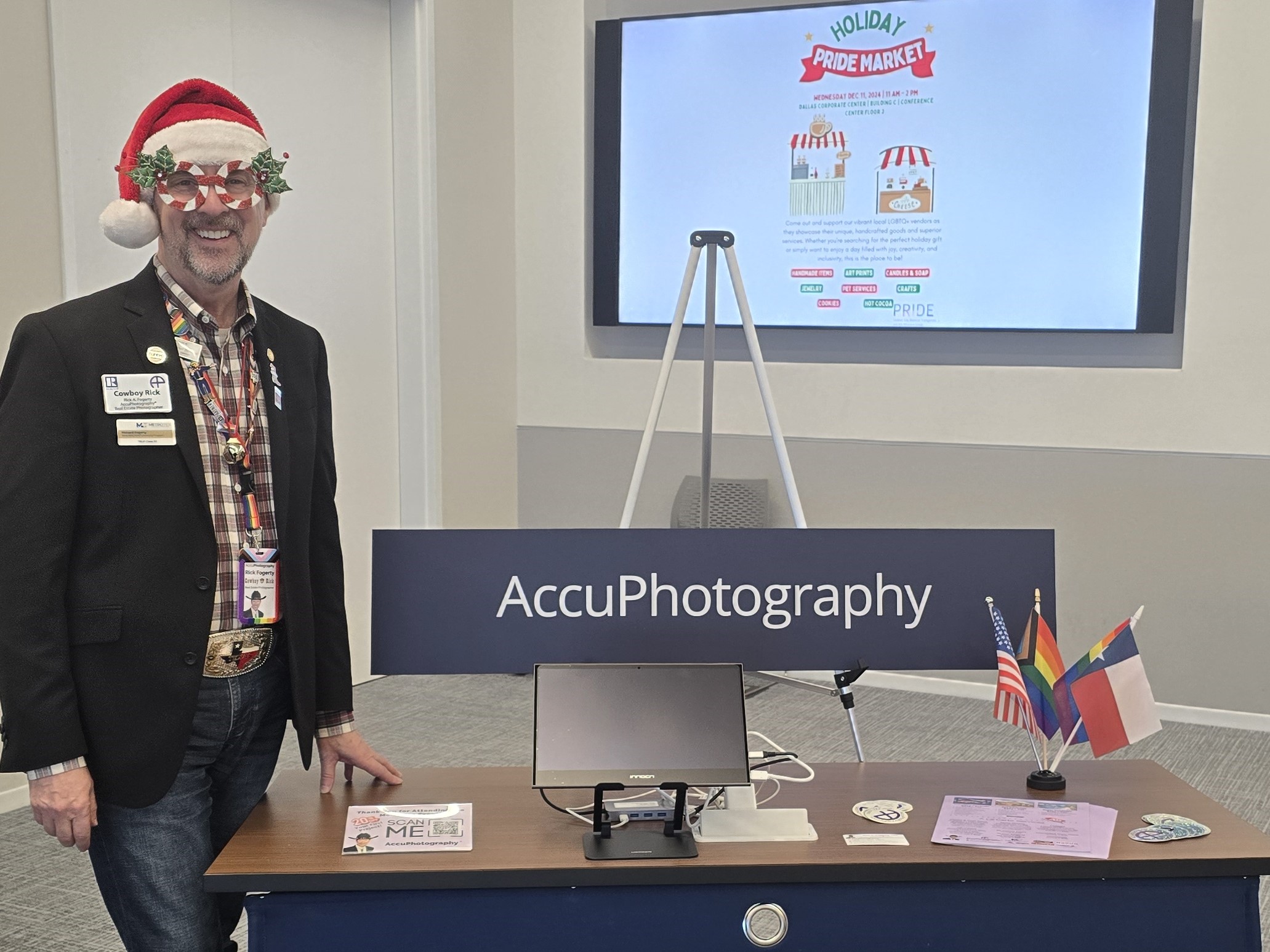 Rick At Accuphotography Vendor Table At Chase Pride Showcase Rick standing by his vendor table at the chase pride showcase event, showcasing accuphotography services in plano.
